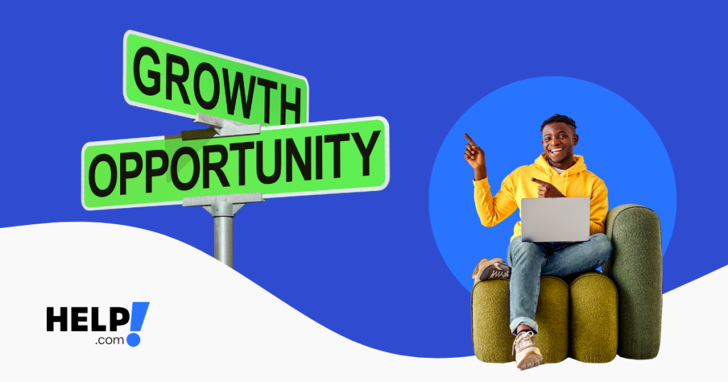 Man sitting with a laptop pointing at a sign ready growth opportunities